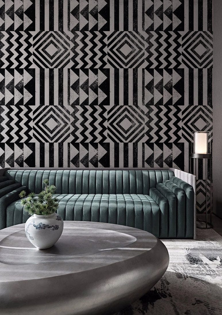 Black and white geometric wallpaper, modern design, green sofa, grey stone table in stylish living room.
