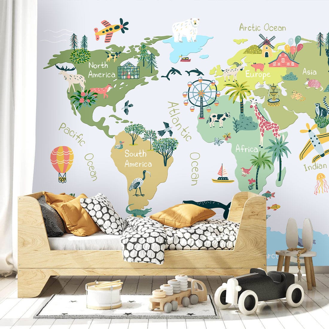 Colourful world map kids' wallpaper in nursery with wooden bed, playful decor, and light hardwood flooring.
