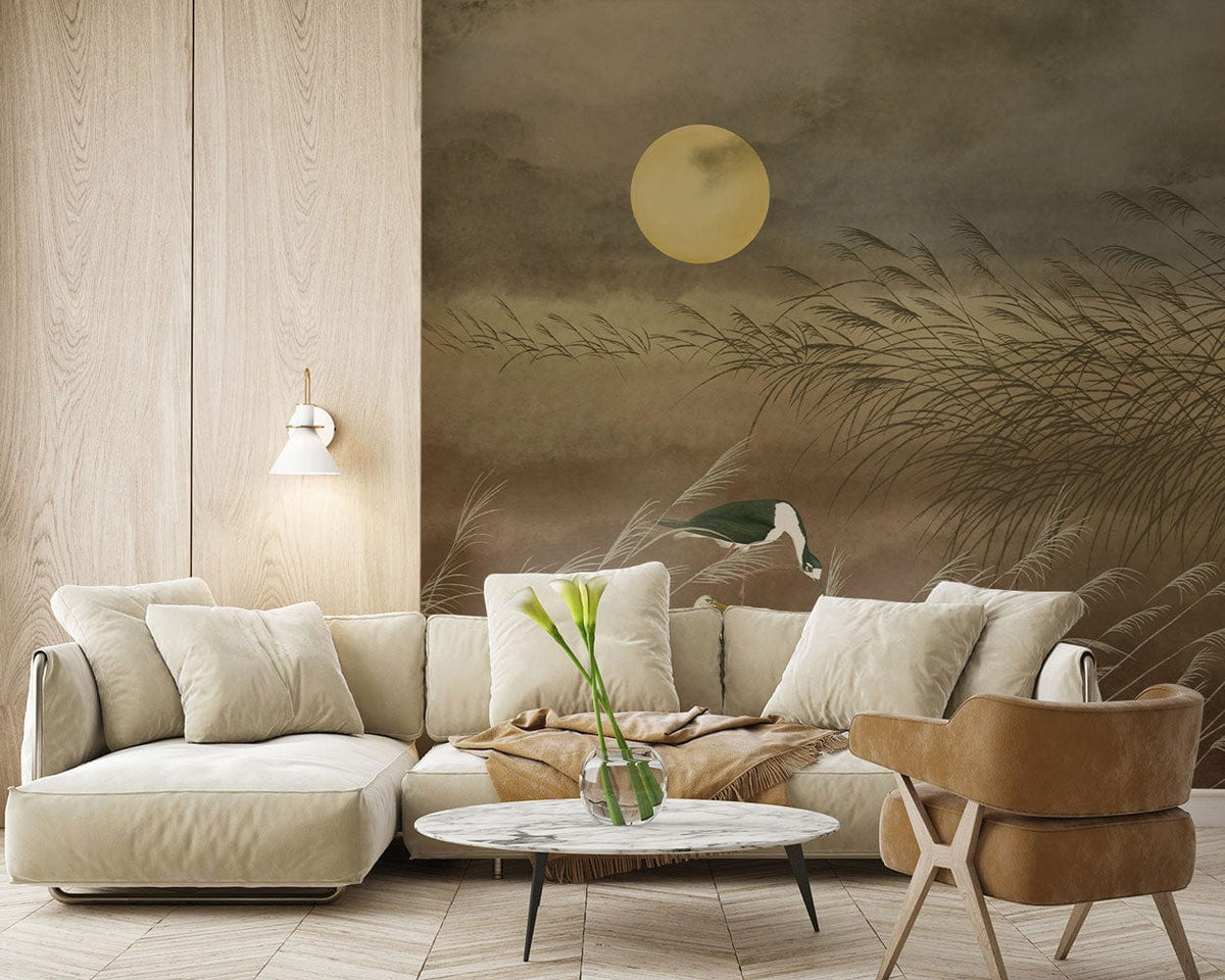 Elegant room featuring Tranquil Heron mural wallpaper, beige sofa, wooden flooring, and modern armchair.