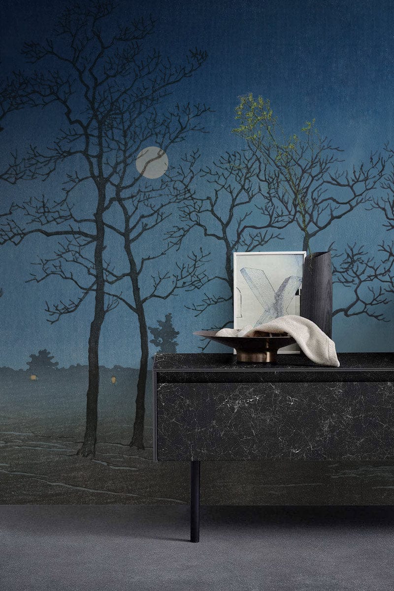 Midnight Mist Blue Woodland Silhouette Wallpaper, tranquil trees, dark console, grey flooring, serene atmosphere.