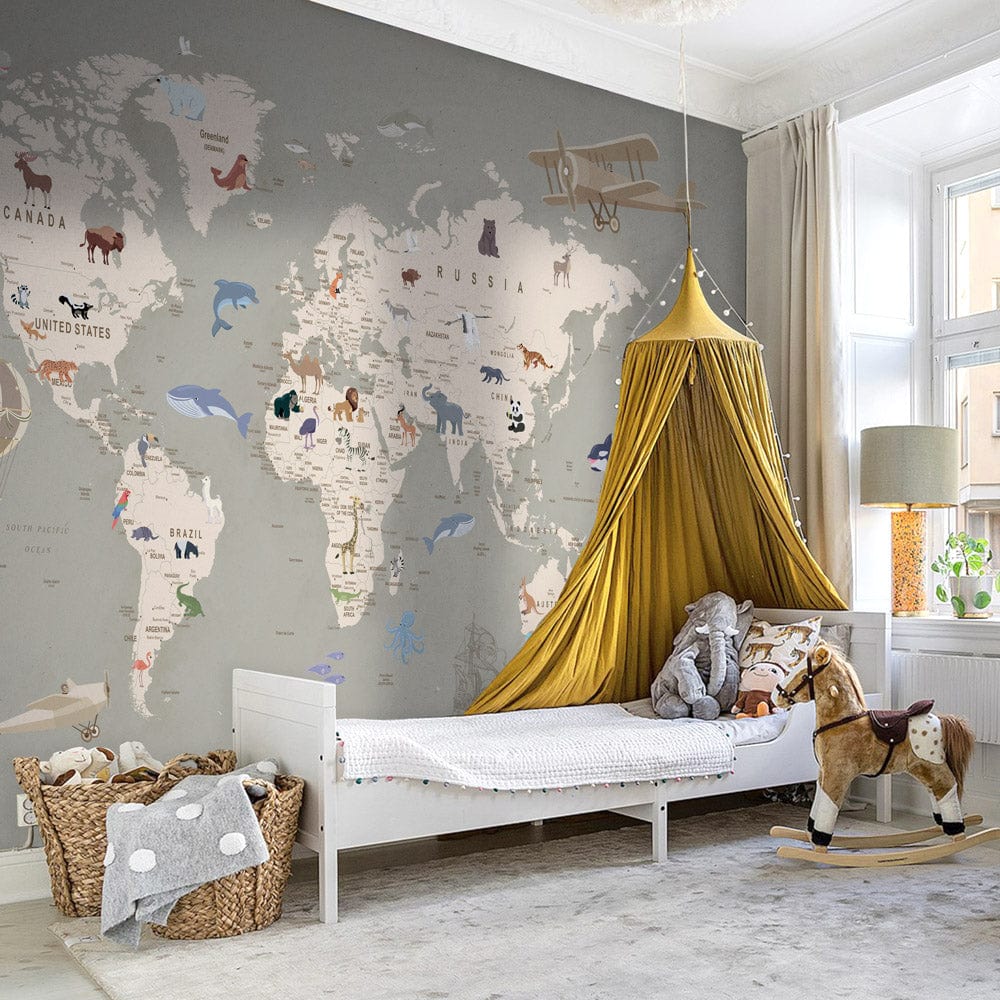 Vintage world map mural wallpaper, animals, grey wall, children's room, canopy, white bed, wooden floor.