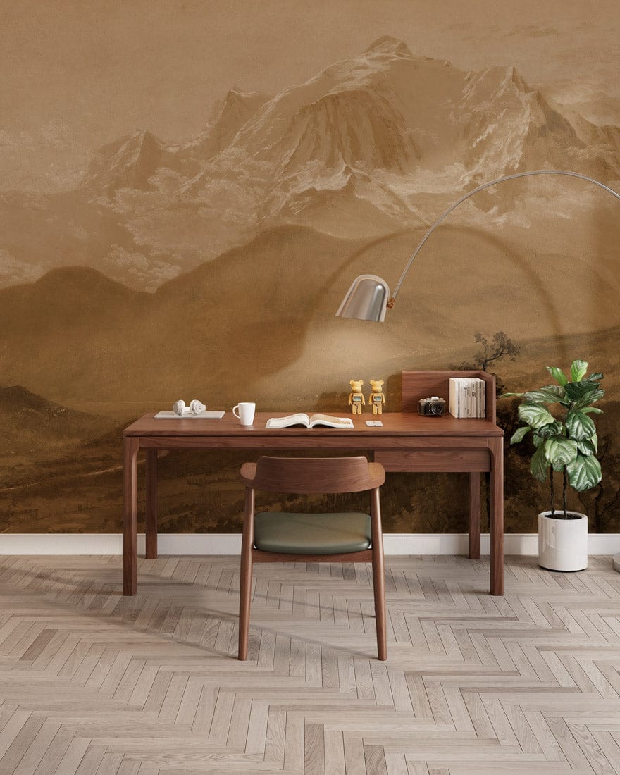 Sepia mountain mural wallpaper with wooden desk, modern lamp, parquet flooring, and green chair in study.