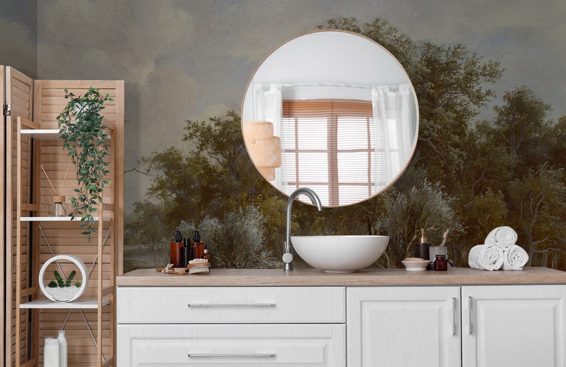 Elegant pastoral mural wallpaper in vintage bathroom; round mirror; white vanity; rustic wood shelving.