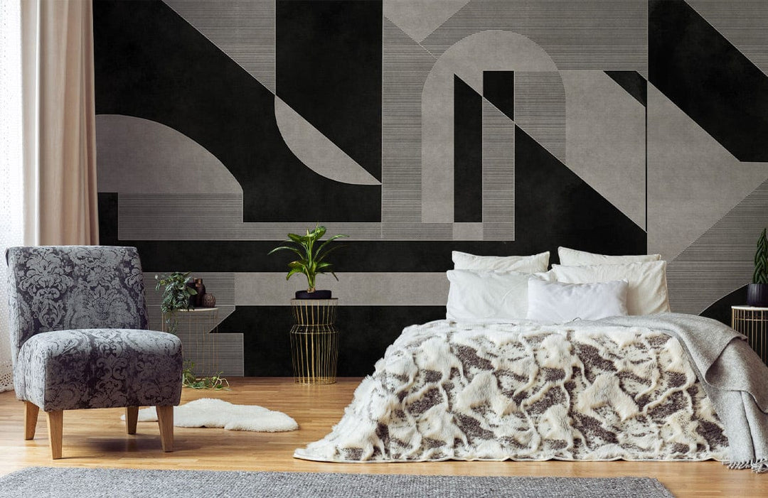 Monochrome Art Deco wallpaper, patterned chair, cosy bed with fur blanket, wooden flooring, elegant bedroom setting.