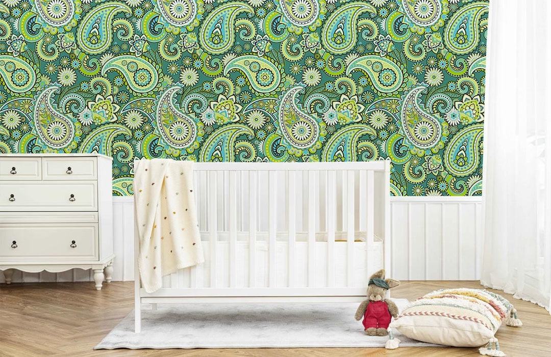 Vintage Green Paisley patterned wall, white crib, dresser; herringbone floor in retro-styled nursery.