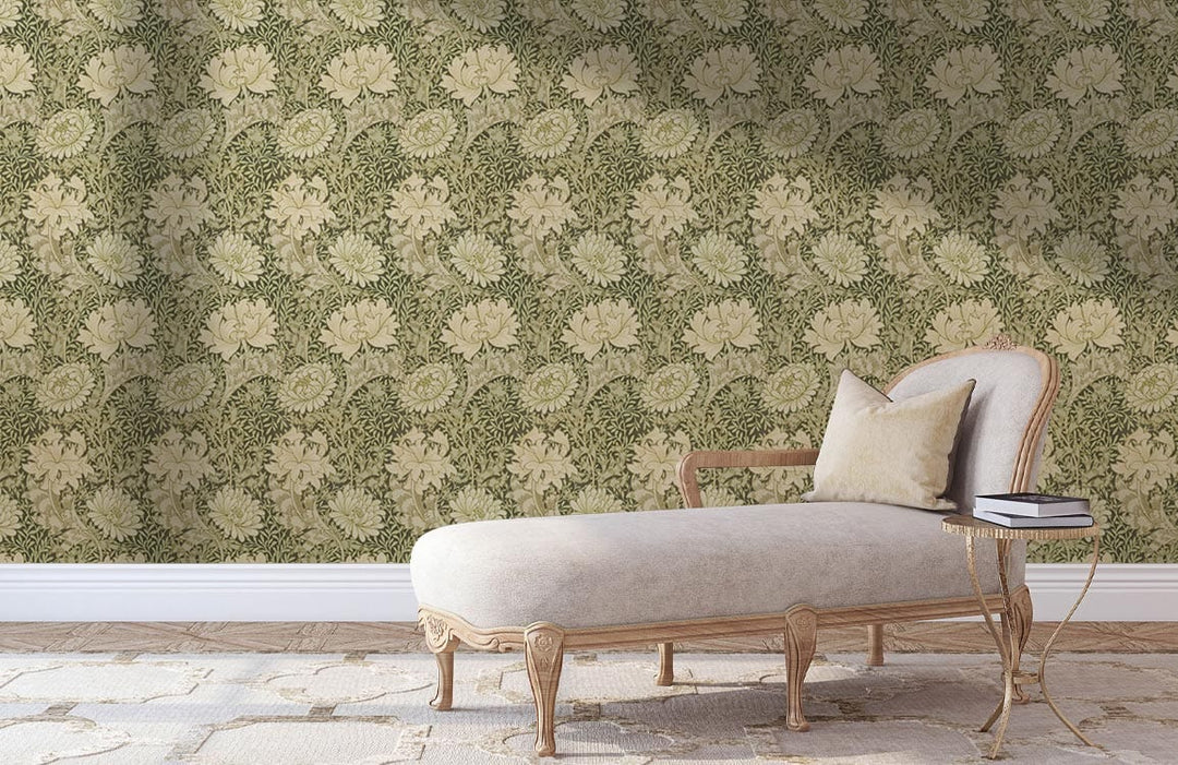 Elegant sage green floral wallpaper complements vintage chaise longue in bright, neutral-toned room setting.
