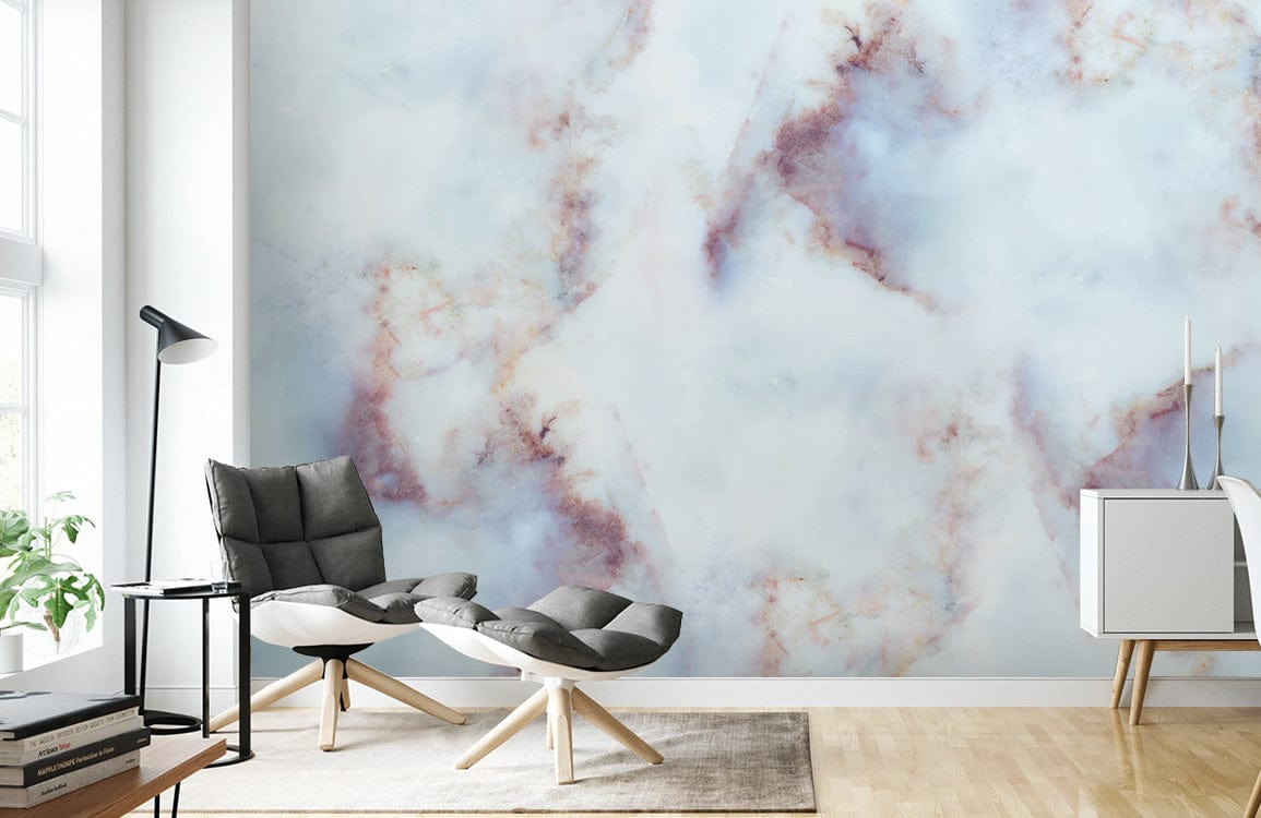 Blue and earthy abstract watercolour mural wallpaper, featuring grey chair, in modern living room setting.