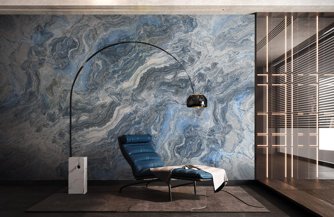 Elegant blue-grey marble effect wallpaper in modern living room, featuring leather recliner and floor lamp.