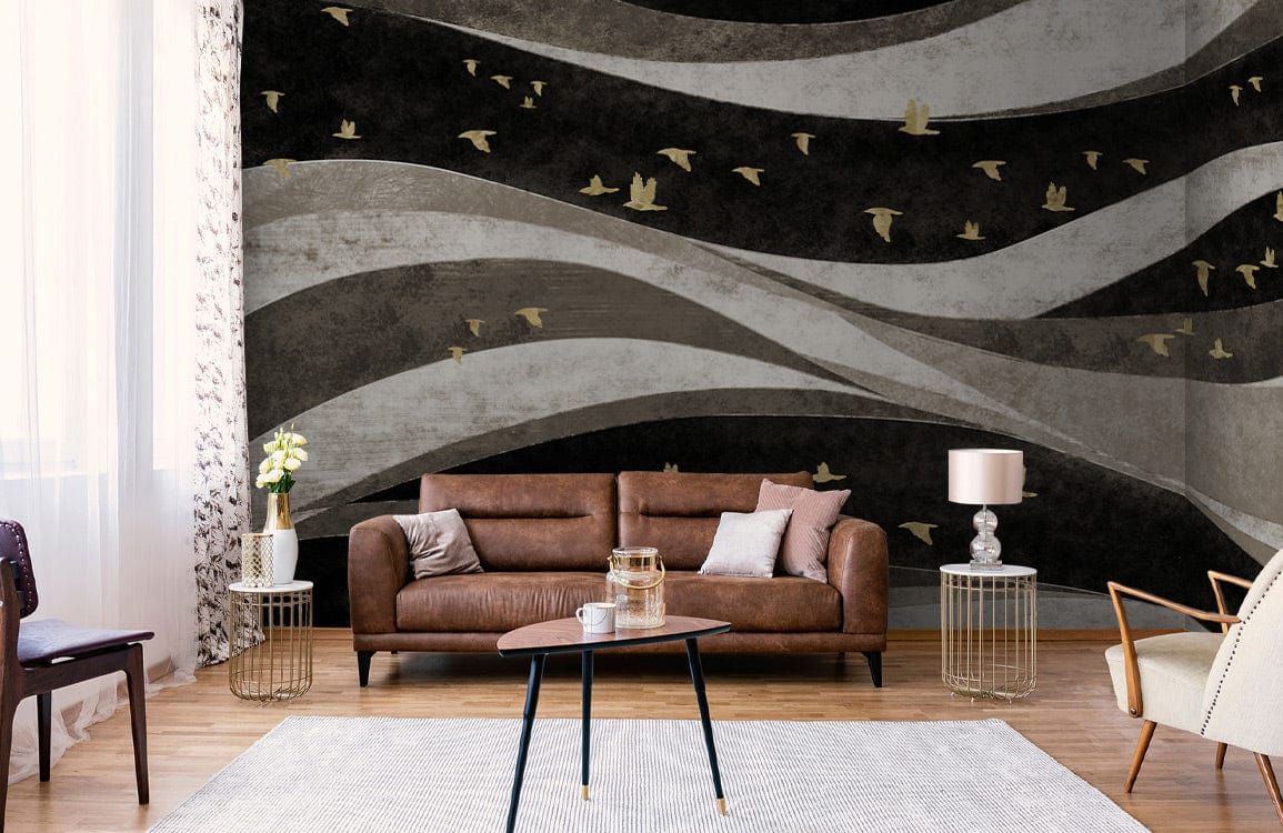 Brown sofa in living room with Abstract Waves and Birds Mural Wallpaper, gold accents, hardwood flooring.