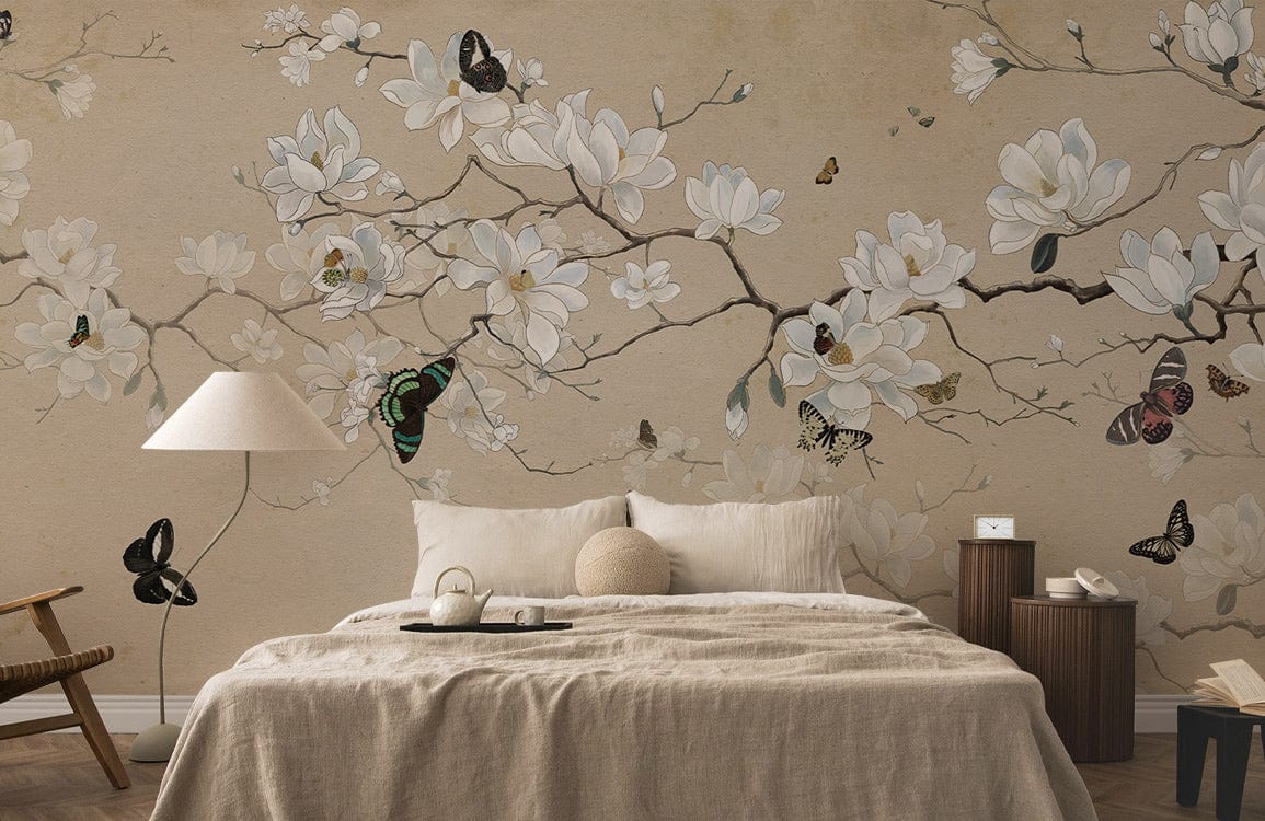 Elegant beige magnolia butterfly mural wallpaper in tranquil bedroom; neutral sofa, wooden accents.