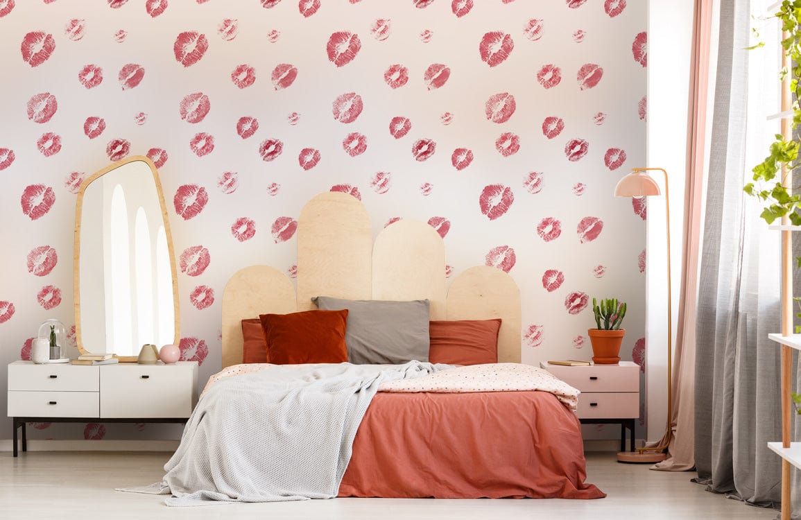 Chic red polka dot wallpaper in bedroom with wooden bed, modern mirror, and stylish lamp.