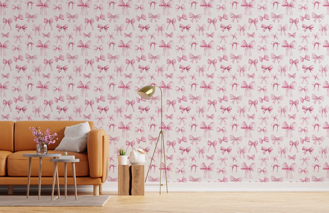 Charming Pink Bow Pattern Wallpaper with orange sofa, wooden floor, and tall lamp in chic setting.