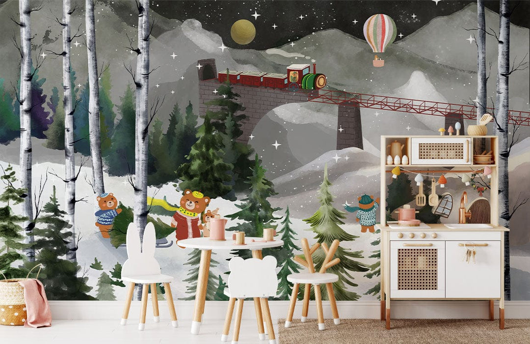 Enchanting Winter Wonderland mural wallpaper in child's room with cute bears, train scene, and wooden furniture.