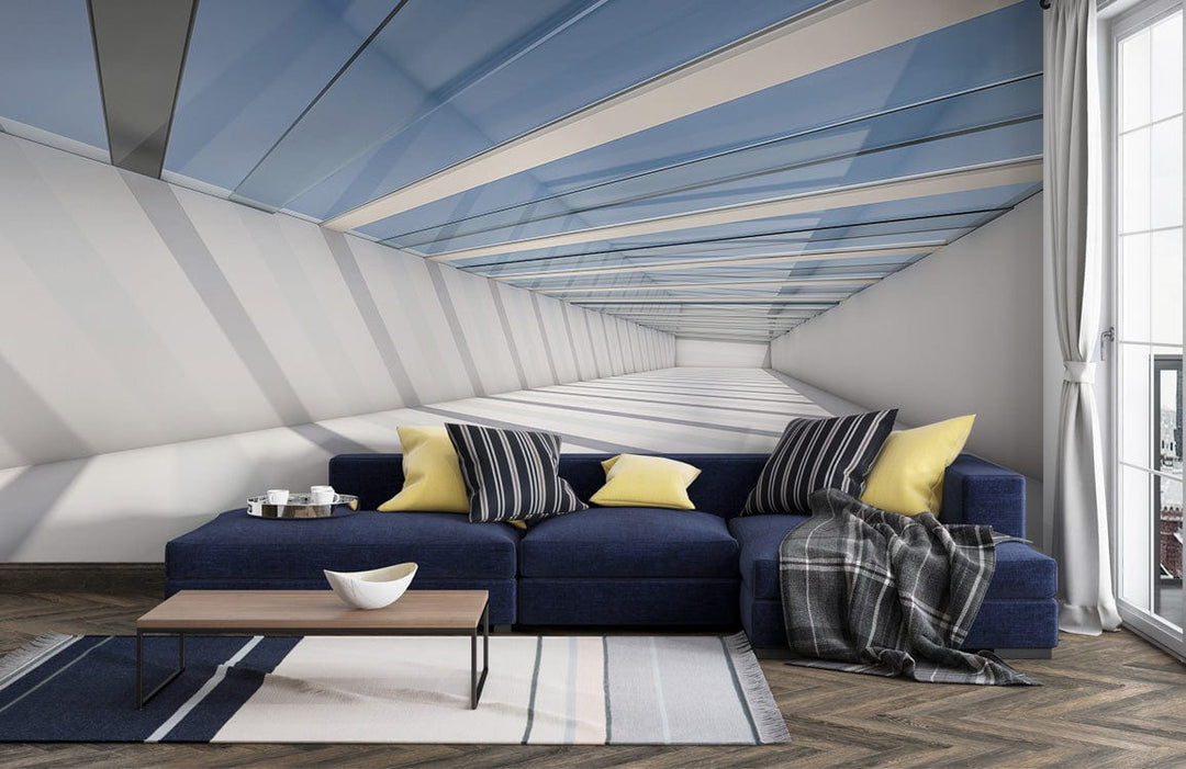Modern blue and white tunnel mural in living room with navy sofa, wooden flooring, striped rug.