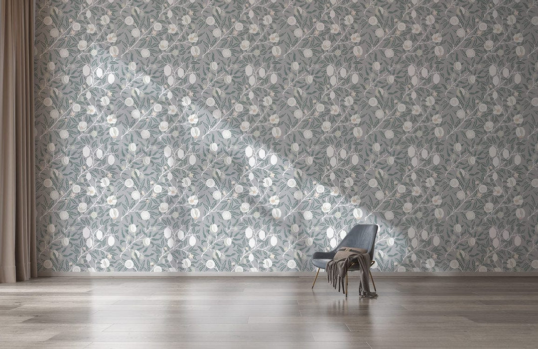 Soft Grey Floral Elegance wallpaper in living room with modern chair, wooden flooring, and neutral curtains.