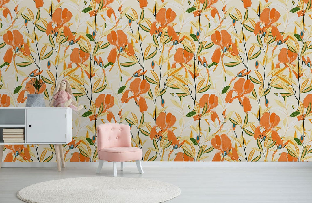 Orange floral wallpaper, pink chair, white cabinet, light wooden flooring, stylish living room decor.