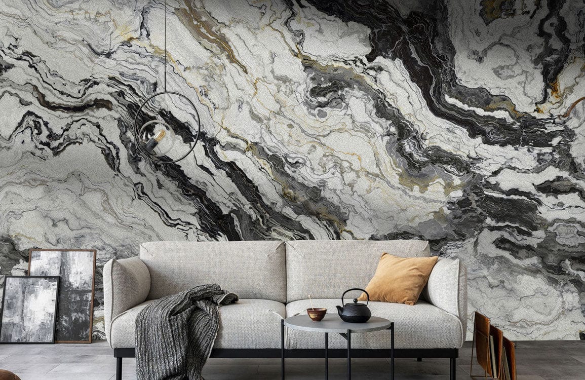 Modern grey sofa in front of marbled grey and white wallpaper, minimalist decor, monochrome theme.