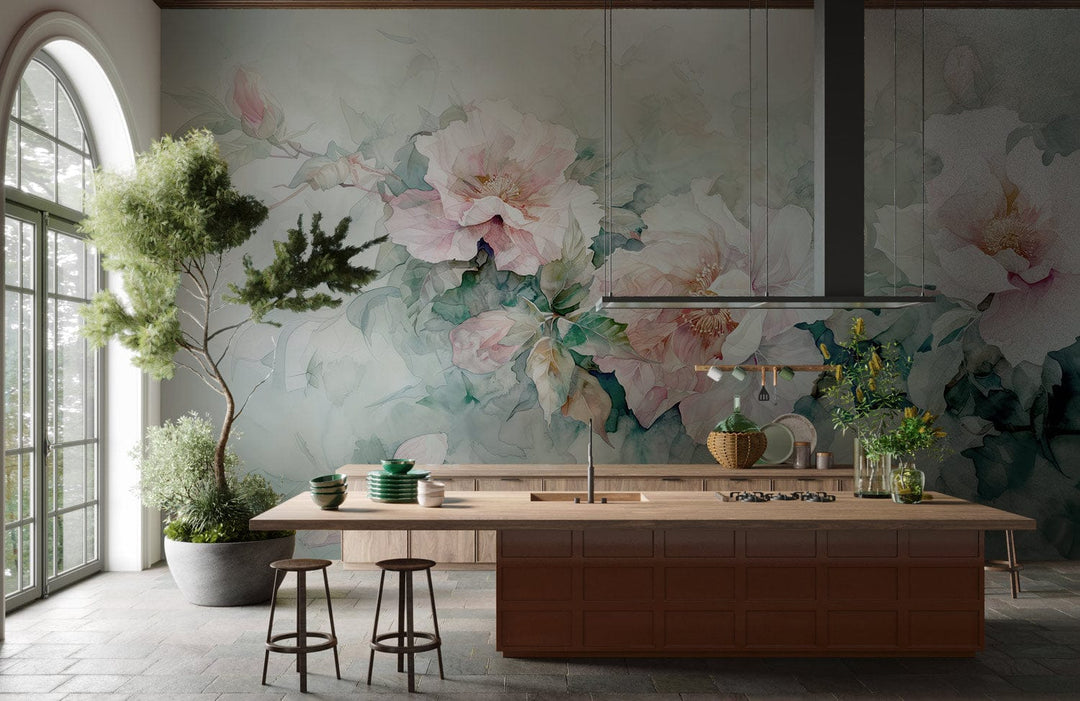 Elegant Pastel Floral Watercolour Mural Wallpaper in kitchen; stone flooring; wooden kitchen island; greenery.