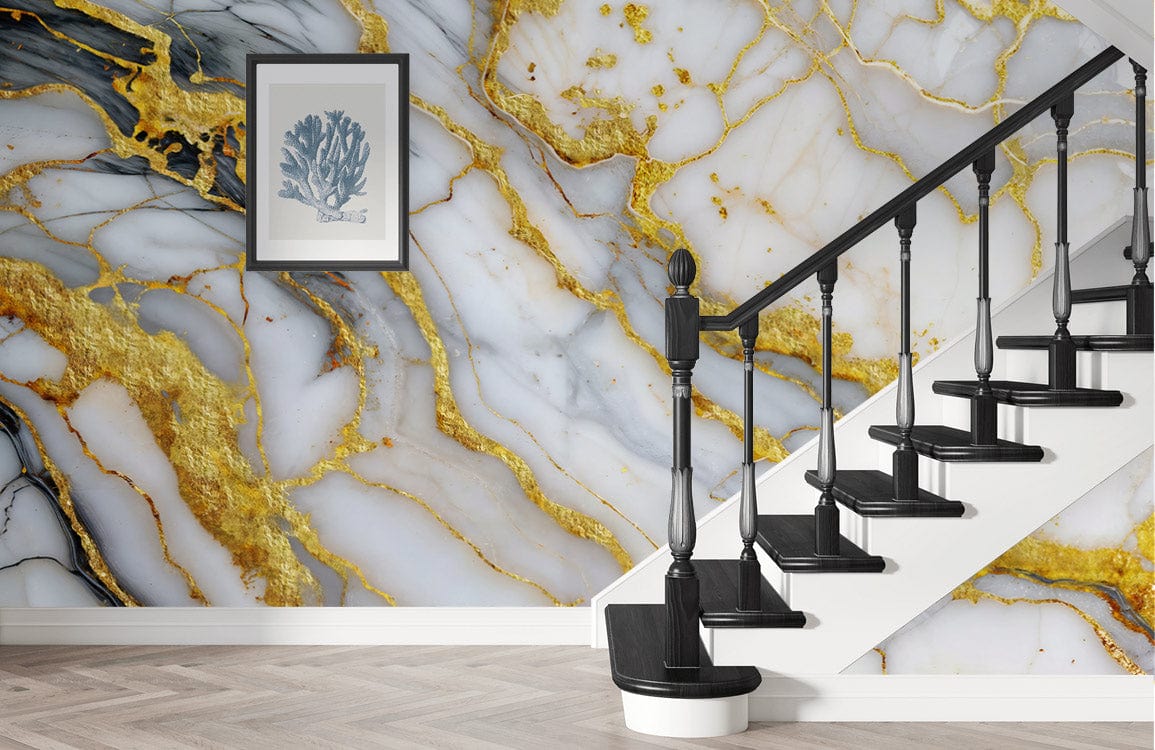 Luxurious gold-veined marble wallpaper and staircase in elegant living room with framed art, wood flooring.