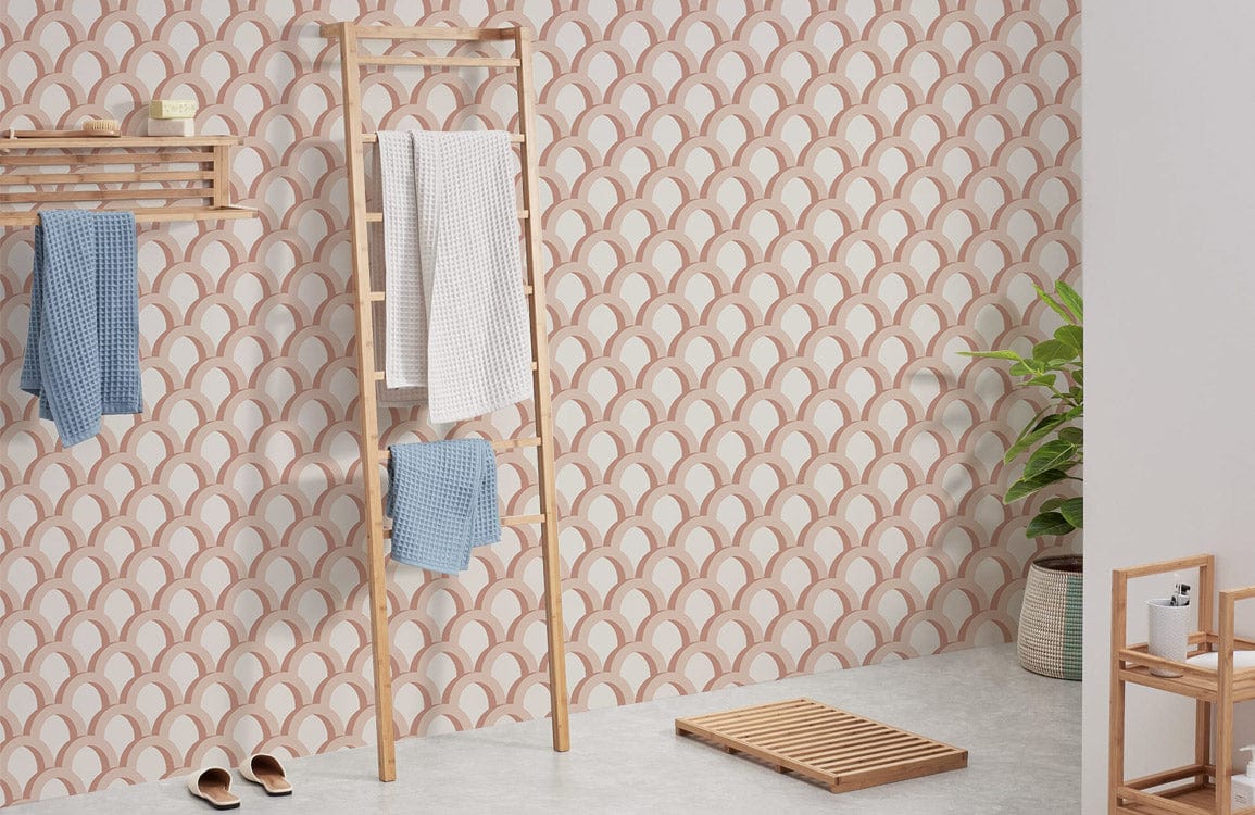 Elegant peach scales pattern wallpaper, minimalist design; bathroom with wooden ladder, white towels, plants.