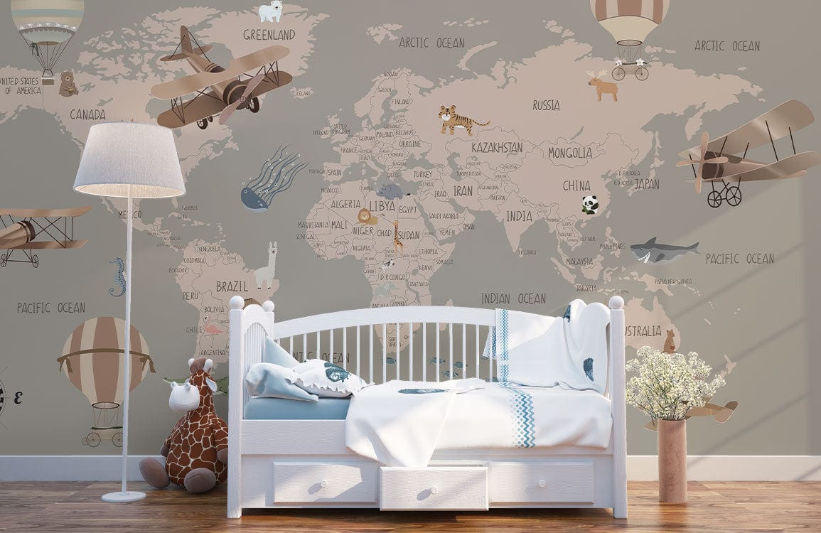 Vintage world map mural wallpaper in taupe tones, aeroplanes, animals, white cot, wooden flooring.