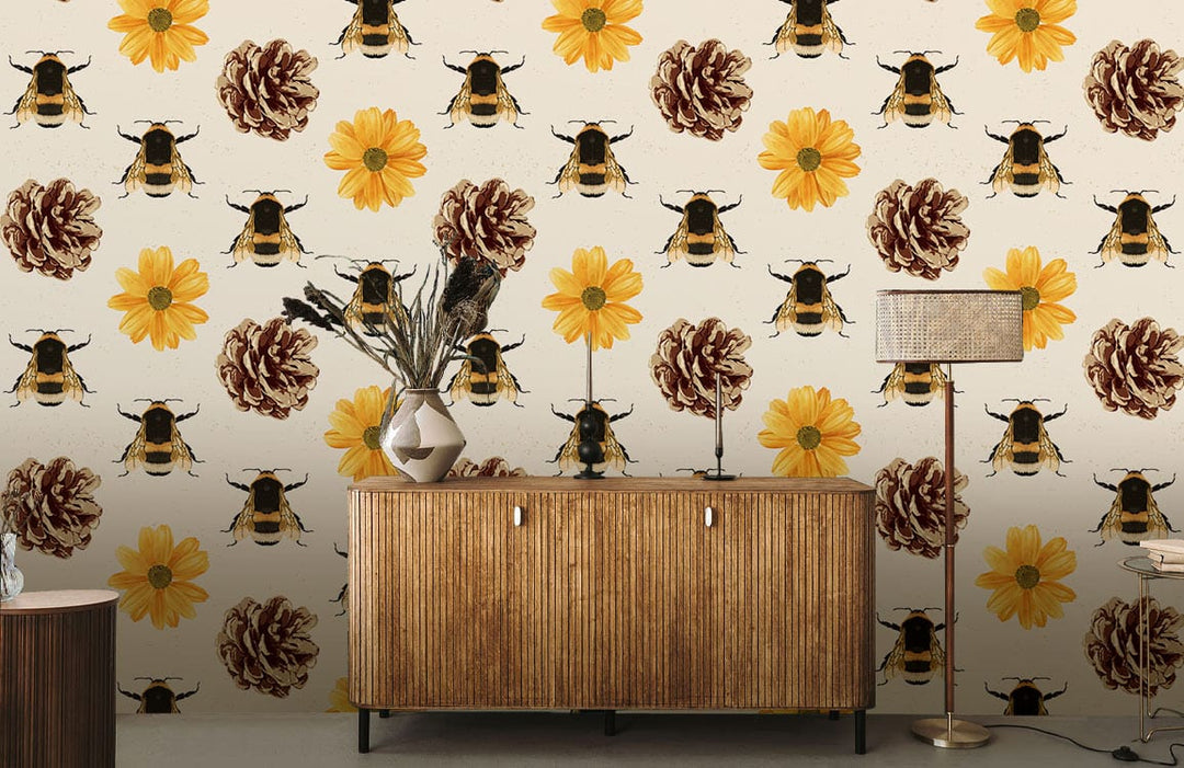 Vintage-inspired bee and floral wallpaper in rustic yellow behind wooden sideboard, neutral lamp, vases.