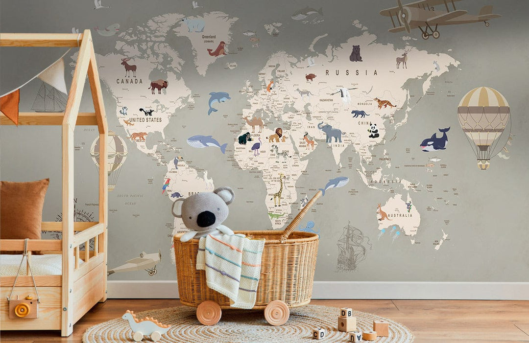 Rustic wooden bed and basket in nursery room featuring vintage world map mural with animals.
