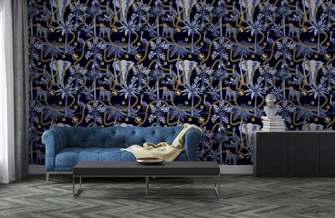 Elegant blue elephant jungle wallpaper, golden accents, blue tufted sofa, grey chevron flooring, modern room.