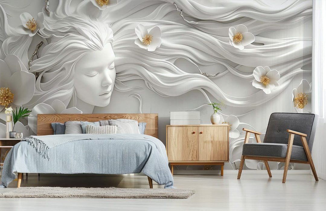 Elegant white floral mural wallpaper in bedroom with wooden furniture, grey armchair, and light flooring.