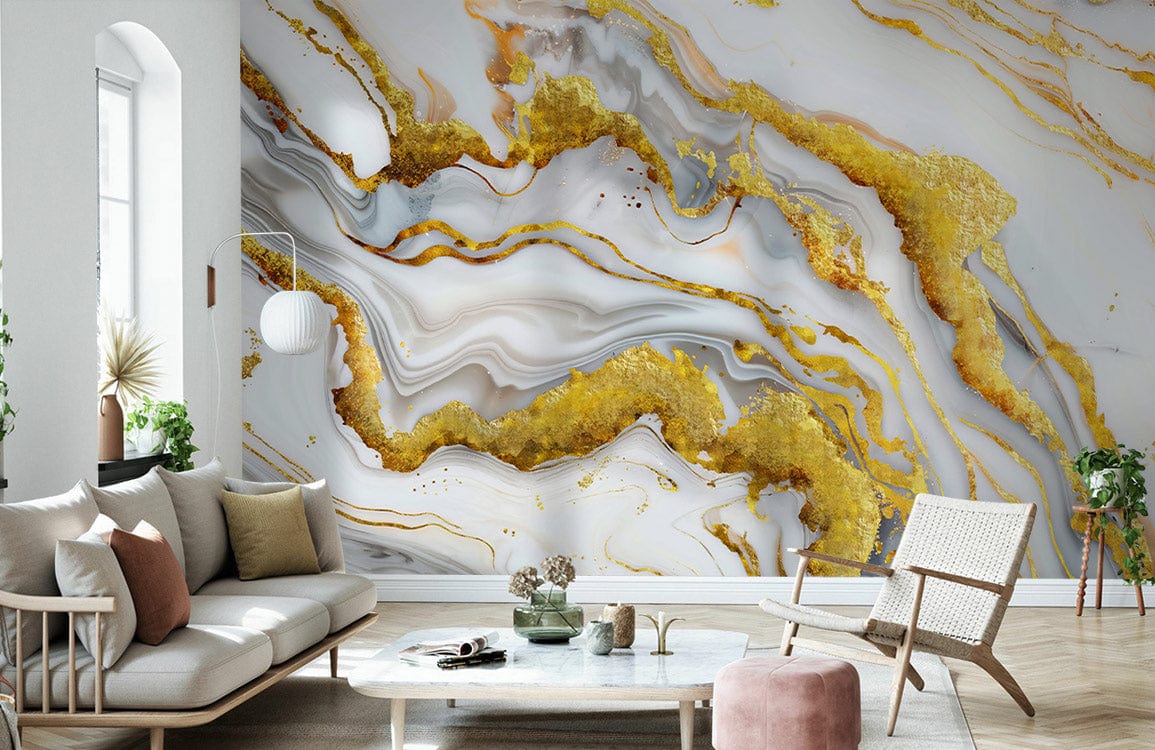 Luxurious living room with gold and white marble effect abstract wall mural, cream sofa, wooden flooring.