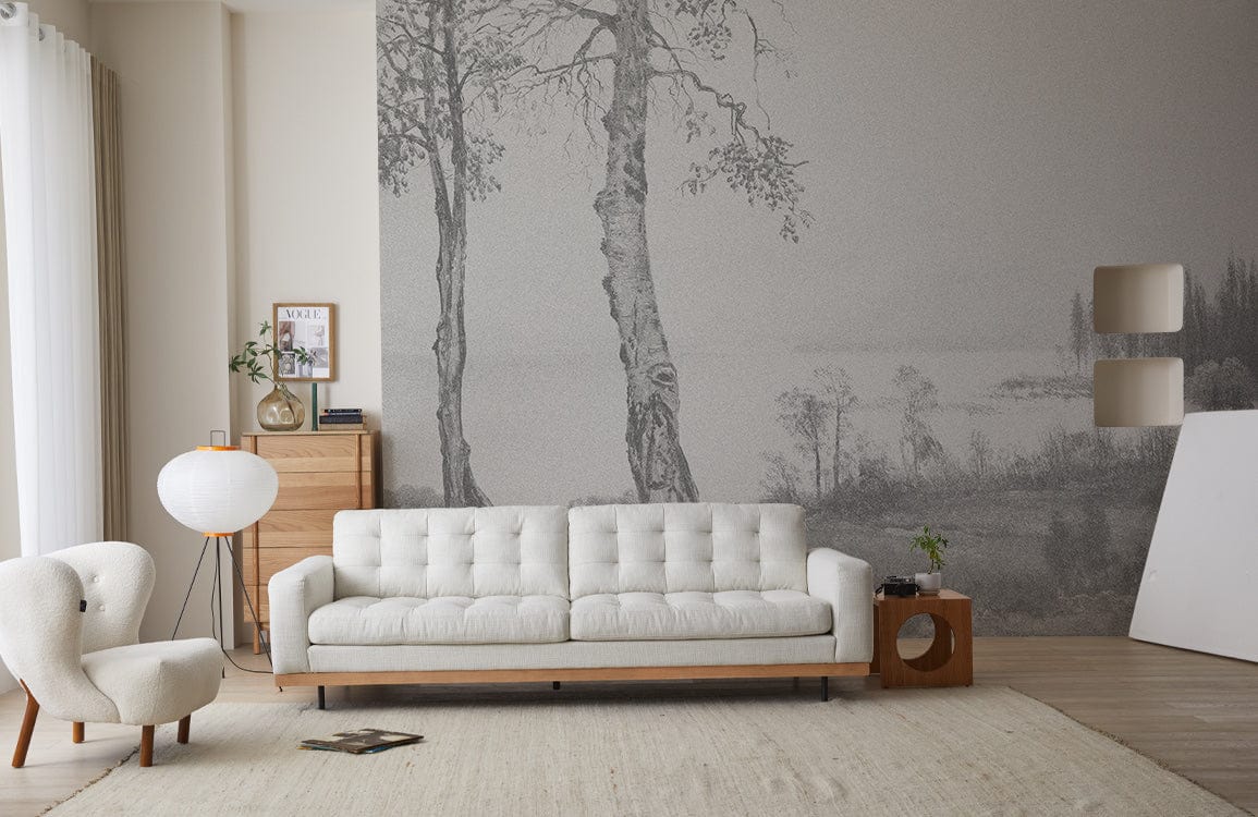 Grey landscape mural wallpaper, light beige sofa, modern living room decor, wooden flooring, serene ambience.