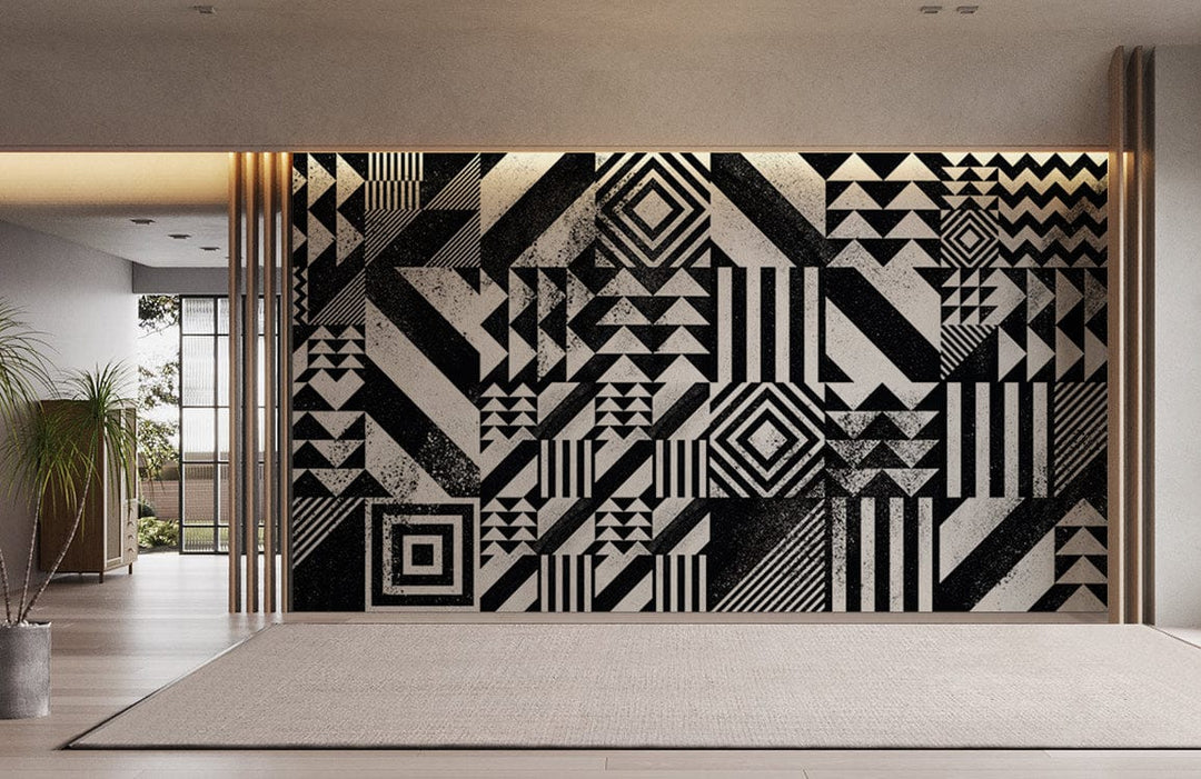 Monochrome geometric patterned wallpaper in modern room with light wood flooring and minimal decoration.