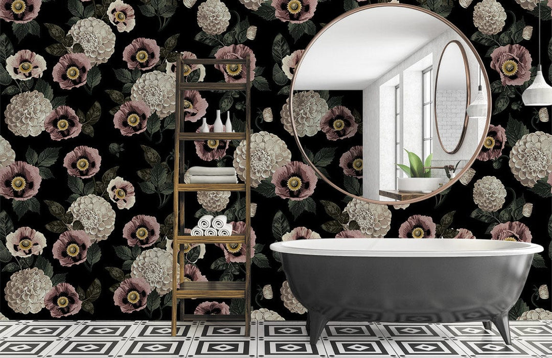 Vintage floral wallpaper with pink, cream blooms; black clawfoot bathtub, circular mirror; geometric flooring.