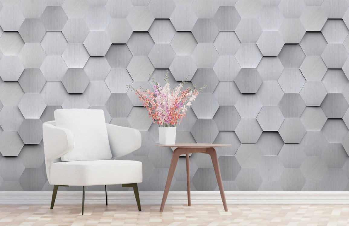 Modern silver hexagonal 3D wallpaper, white armchair, wooden side table, patterned flooring, contemporary room.