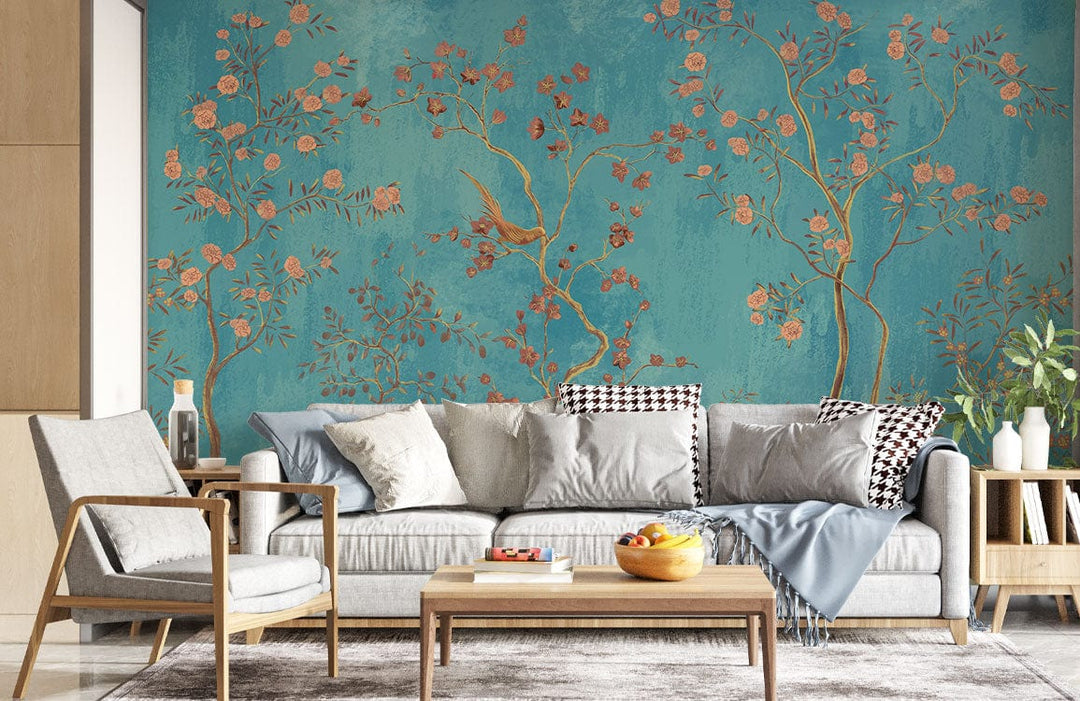 Elegant turquoise floral mural wallpaper with birds, pink blossoms; grey sofa, wooden furniture in modern living room.