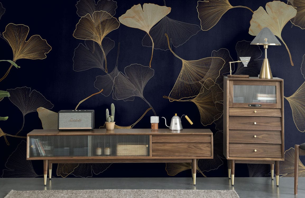 Elegant wallpaper features gold and navy ginkgo pattern, paired with retro wooden furniture in living room.