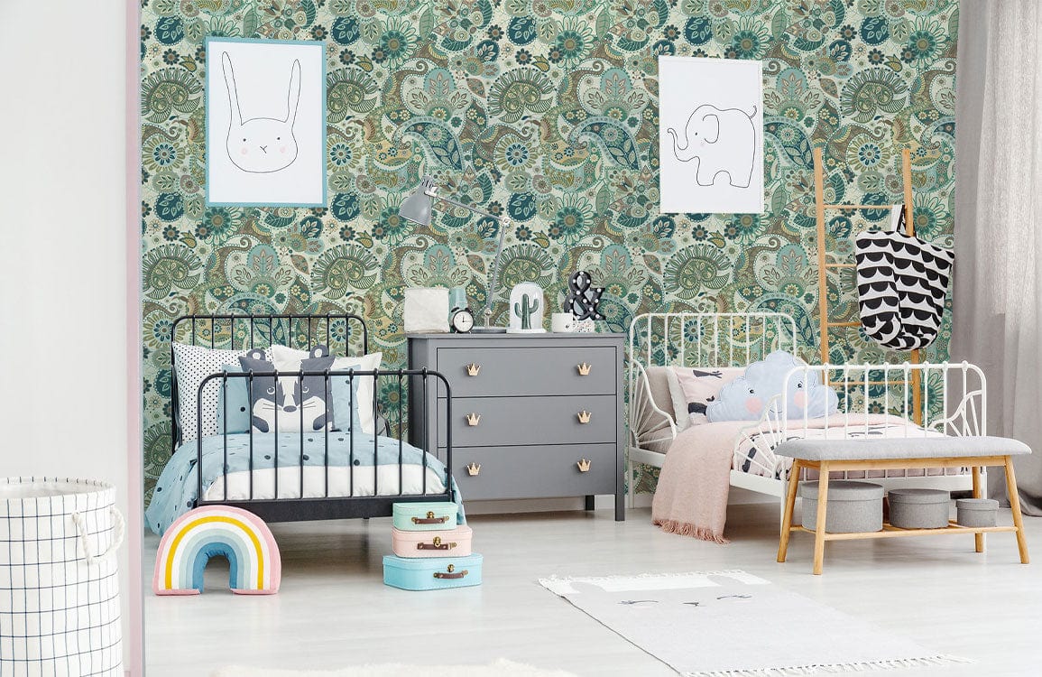 Children's room with teal and beige classic patterned wallpaper, grey dresser, white cribs, light flooring.