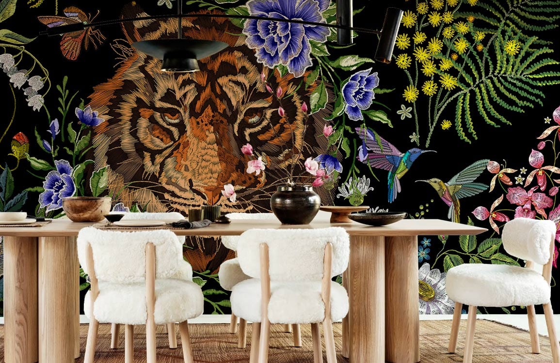 Dining room with floral tiger jungle mural wallpaper, vibrant colours, wooden dining set, white chairs.