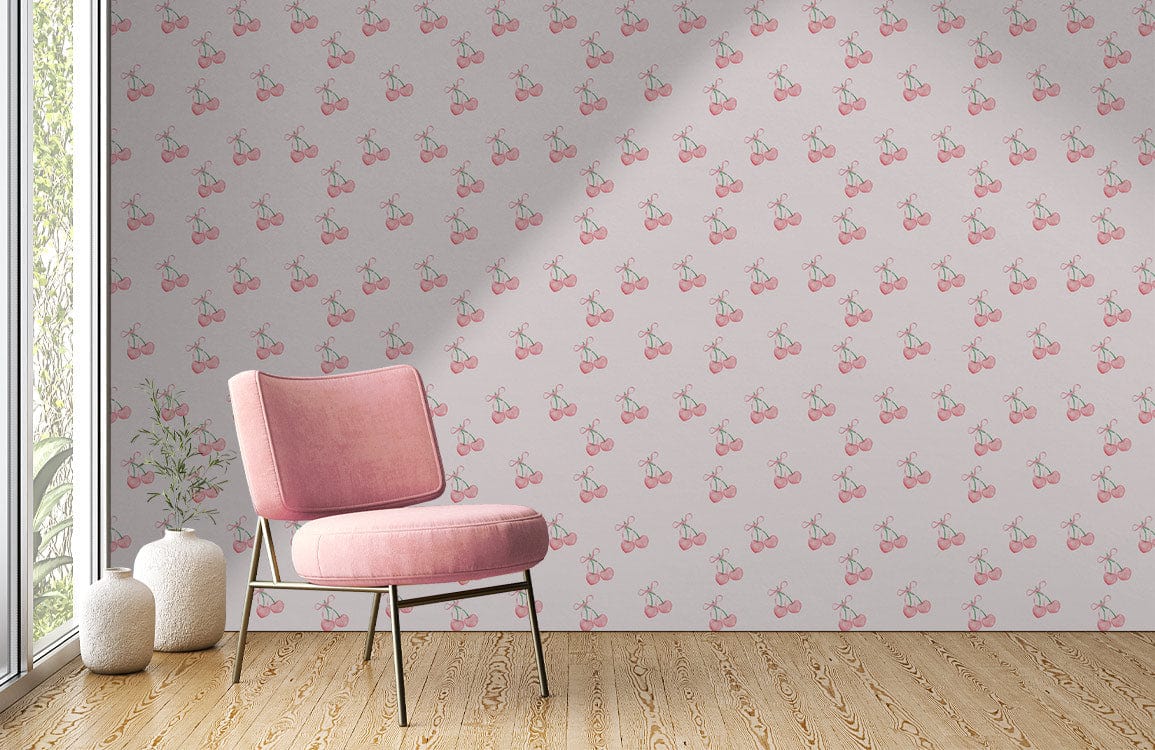 Vintage pink cherry pattern wallpaper; pink chair; wooden flooring; retro interior design style.