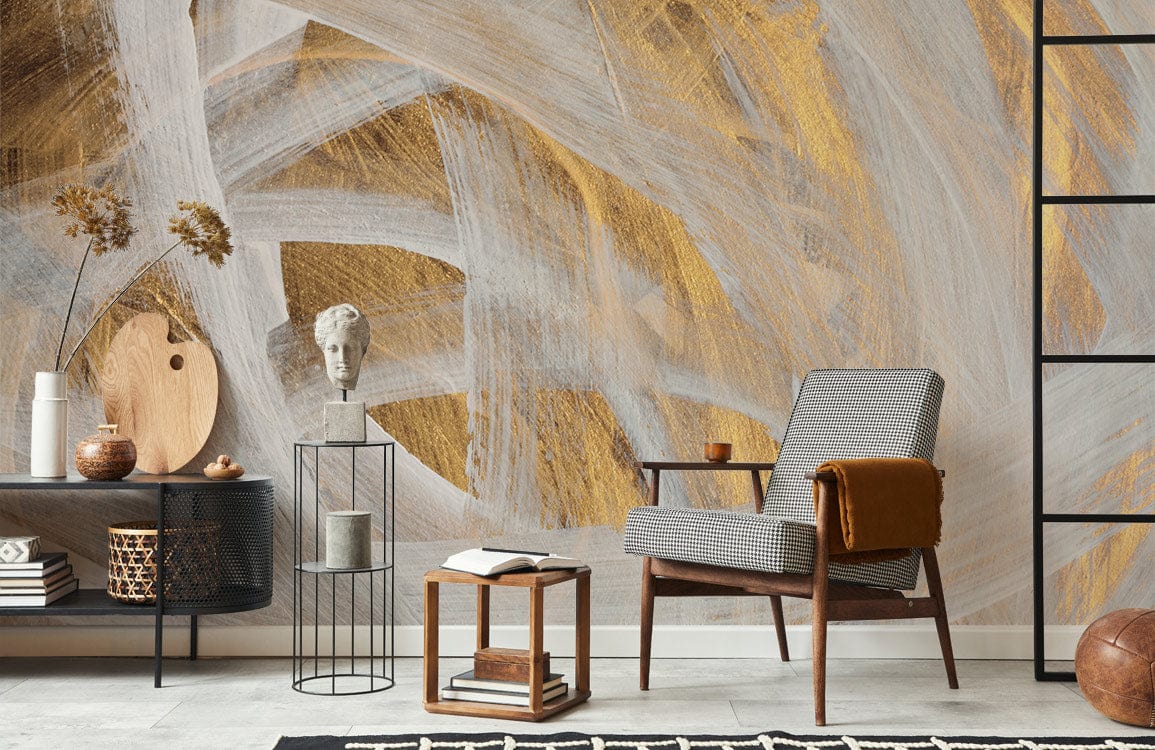 Elegant Gold and White Abstract Brushstroke Mural Wallpaper, grey armchair, minimalist decor, modern room interior.