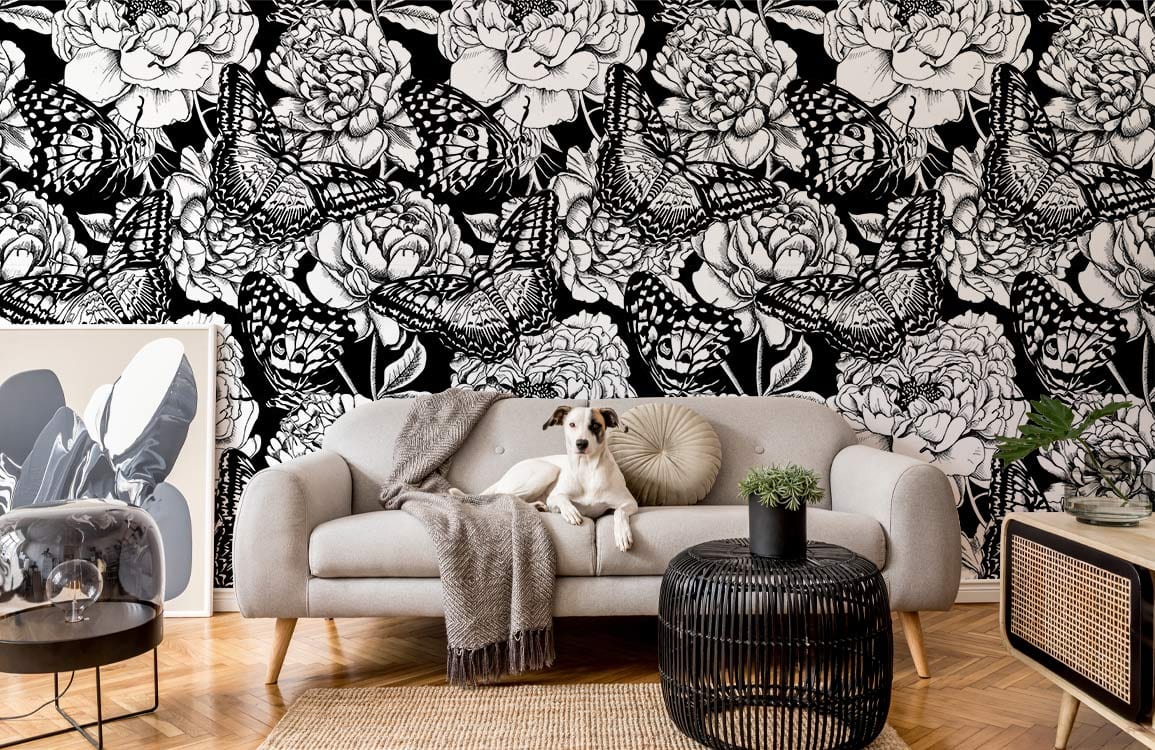 Monochrome Butterfly Garden wallpaper in elegant living room with grey sofa, parquet flooring, stylish decor.