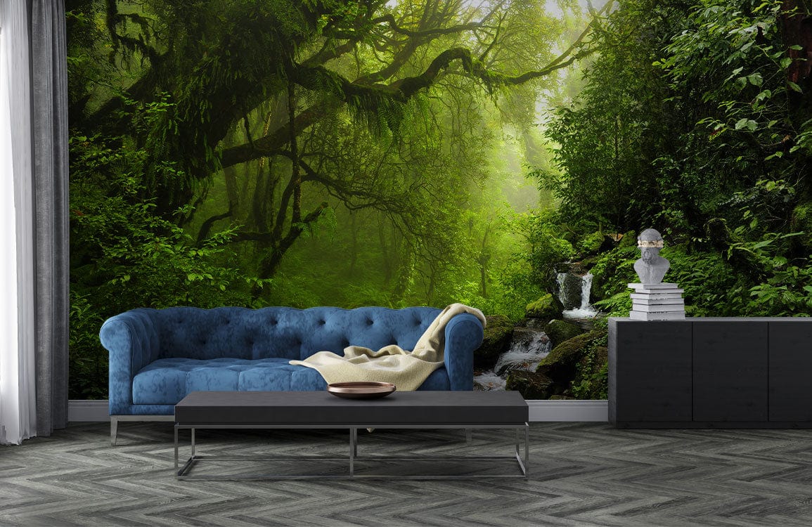 Luxurious forest mural wallpaper, blue sofa, chevron flooring, alluring living room decor, elegant design.