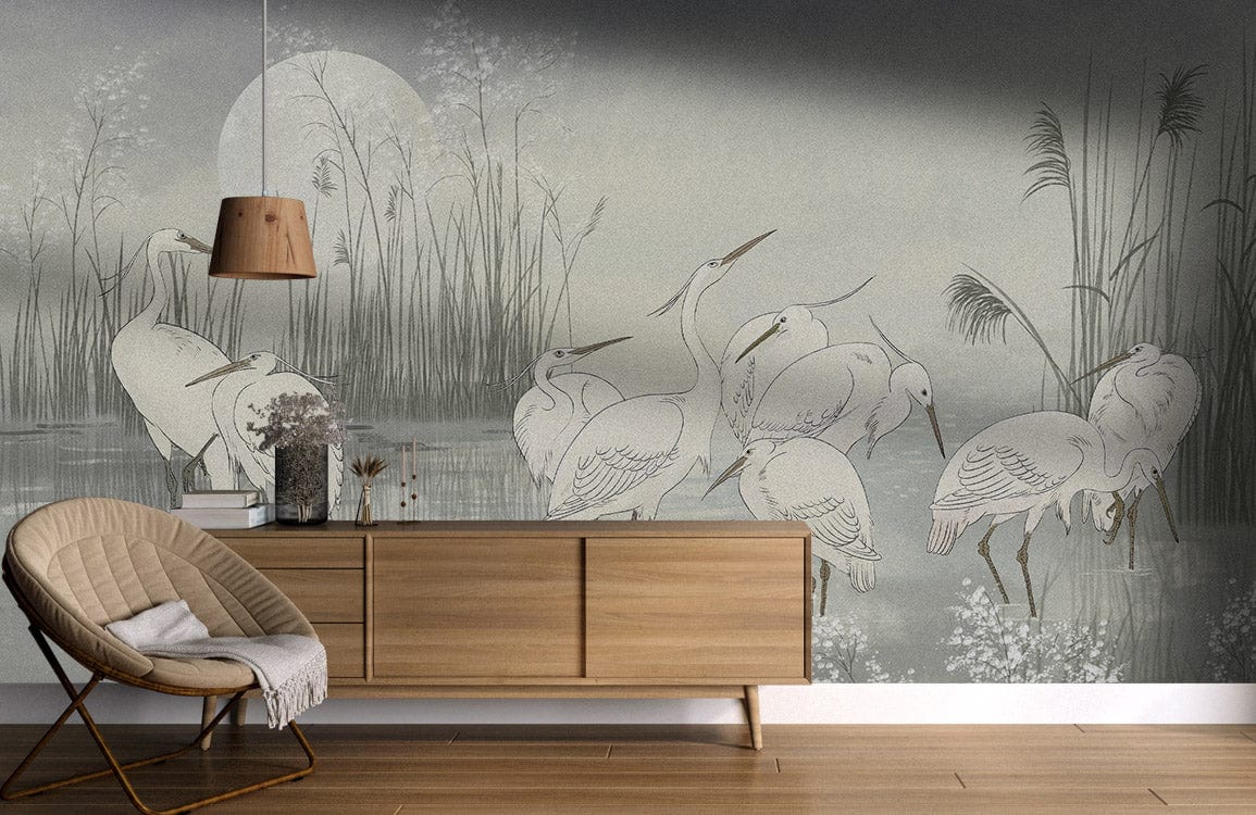 Heron watercolour mural with wood sideboard, rattan chair, minimalist lamp; peaceful living room decor.