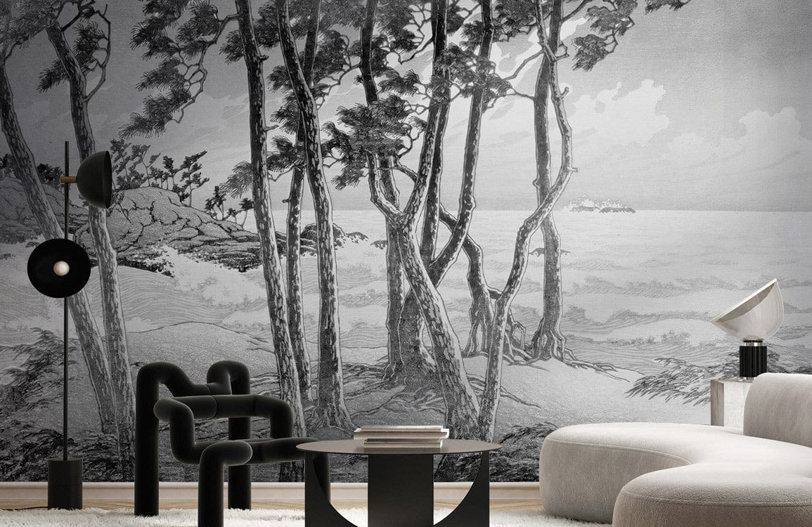 Monochrome coastal forest mural wallpaper in grey tones, modern furniture, black lamp, round coffee table.