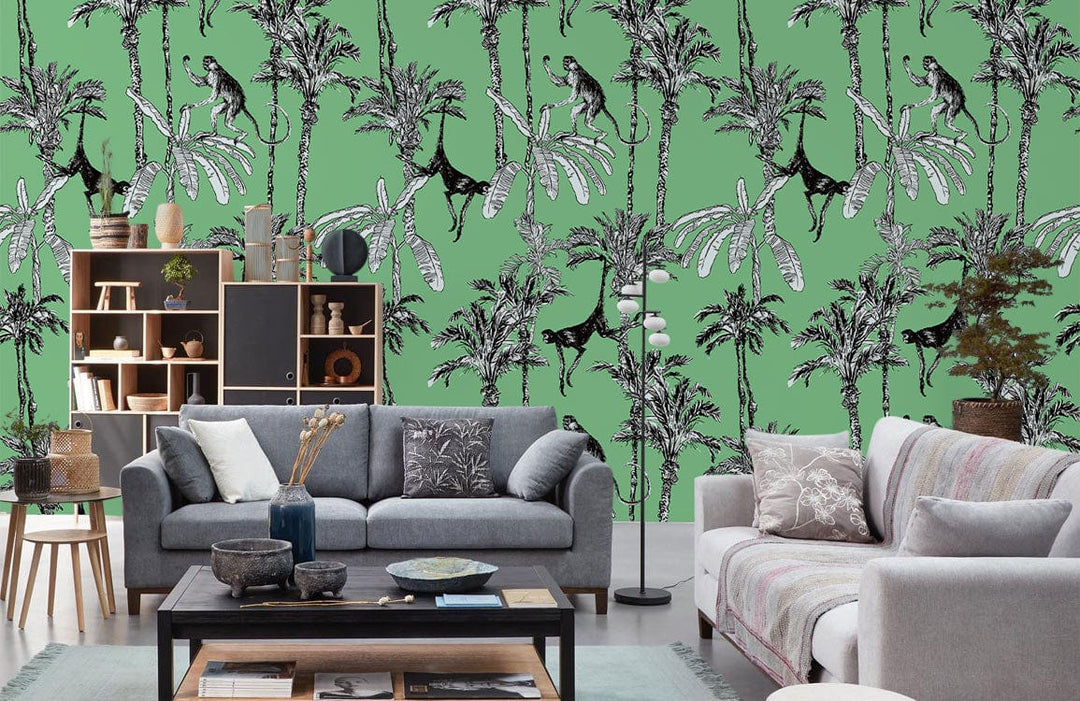 Grey sofas in a living room with Tropical Jungle Art Deco Green Wallpaper, playful monkeys and palms.