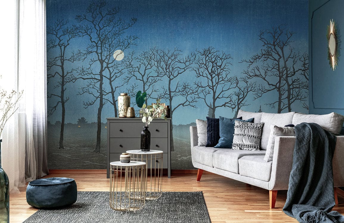 Midnight Mist Blue Woodland Silhouette Wallpaper, grey sofa, wooden flooring, cosy living room.