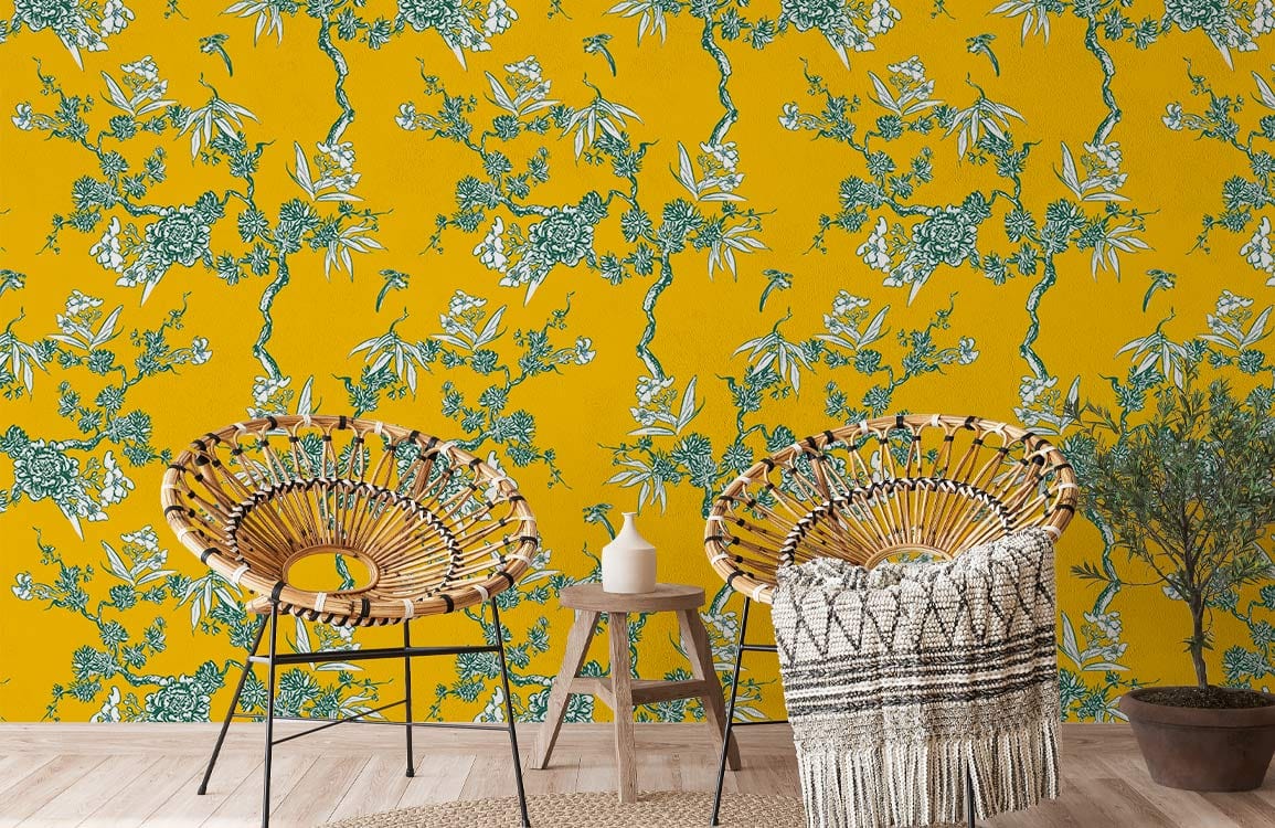 Vintage botanical mustard floral wallpaper; green accents; natural wood flooring; wicker chairs; elegant Décor.