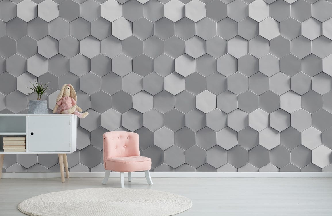 Modern grey hexagonal wallpaper in room with pink chair, white cabinet; contemporary interior design backdrop.
