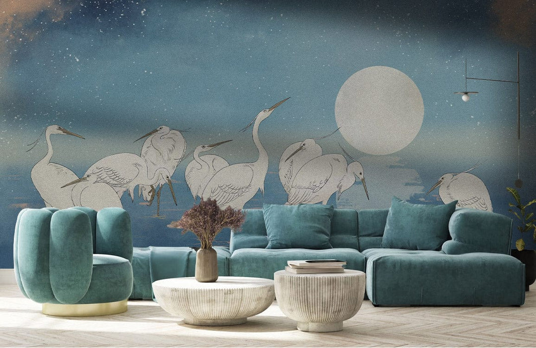 Blue Celestial Heron Sky Mural Wallpaper with teal sofa, round tables, and elegant beige flooring.