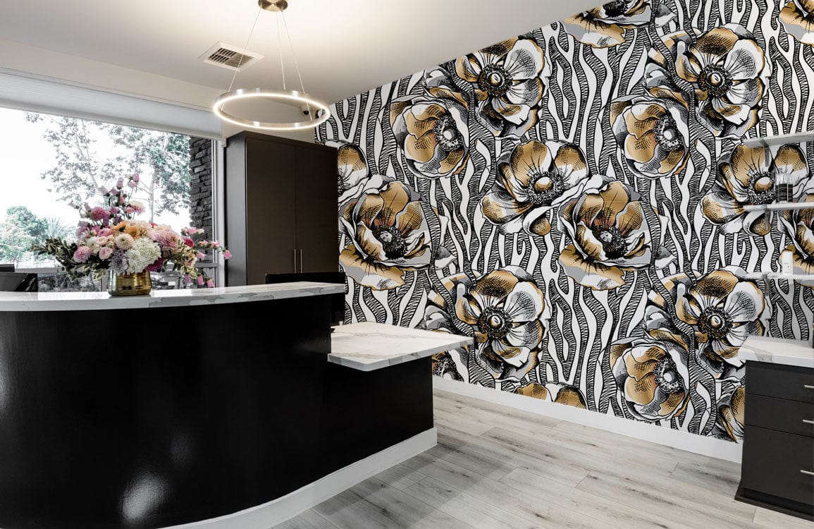 Vintage botanical wallpaper in black, gold; modern monochrome kitchen with dark cabinets, light wood flooring.
